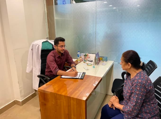Dermatologist in Patel.Nagar, Delhi - Dr. Bhawuk Dhir with Patient
