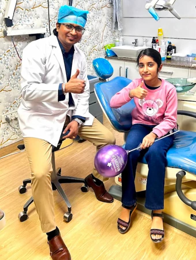 trusted dentist in indirapuram with happy patient